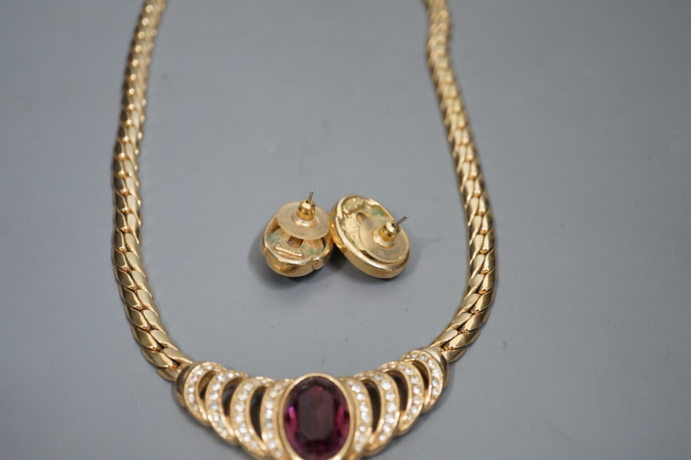 A Christian Dior gilt metal and two colour paste set costume necklace, 36cm and a pair of matching earrings.